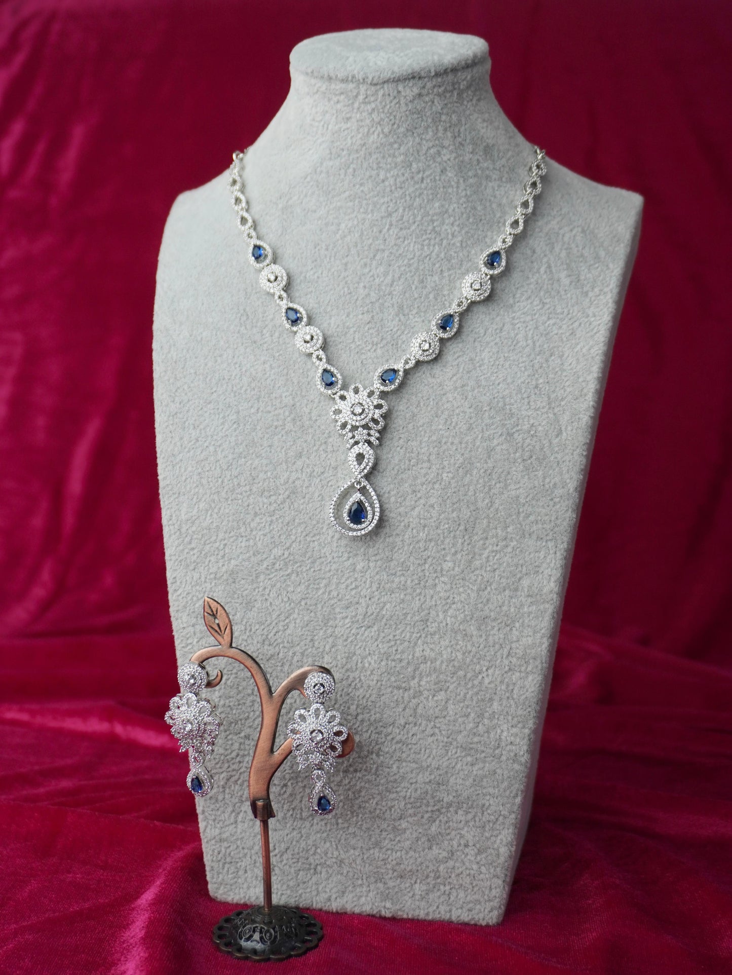 shyamas blue american diamond necklace and earrings